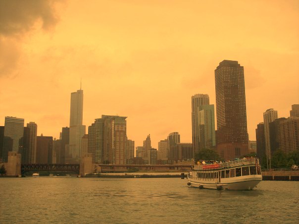 Downtown Chicago boat on river and skyline with golden sky by Hello Lovely Studio