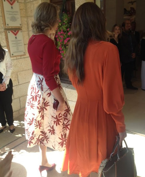 Diane von Furstenberg Flirty Elaphe clutch, Natan dress, dress made by "regular" Jordanian women with local fabrics