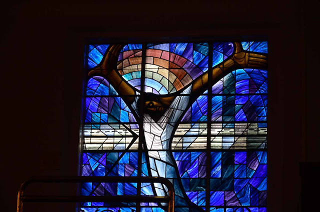 Jesus in defense and comfort, gift of stained glass from Wales