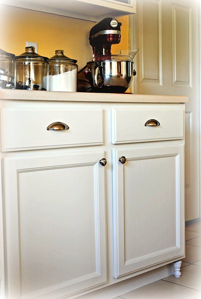 Make Your Own "Frugal" Kitchen Cabinet Feet - At The Picket Fence