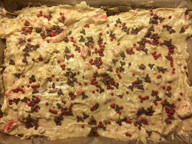 Mixture in a baking tray topped with rudolph sprinkles