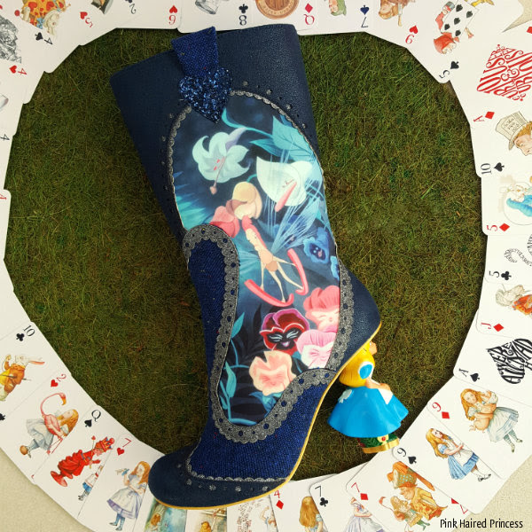 Irregular Choice Alice Lost Your Muchness left boot left boot lying on grass showing flowers scene from Disney Alice movie