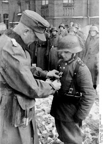 giving military medal hitler youth