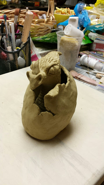 Hatching ceramic dragon, in progress, by Lily L.