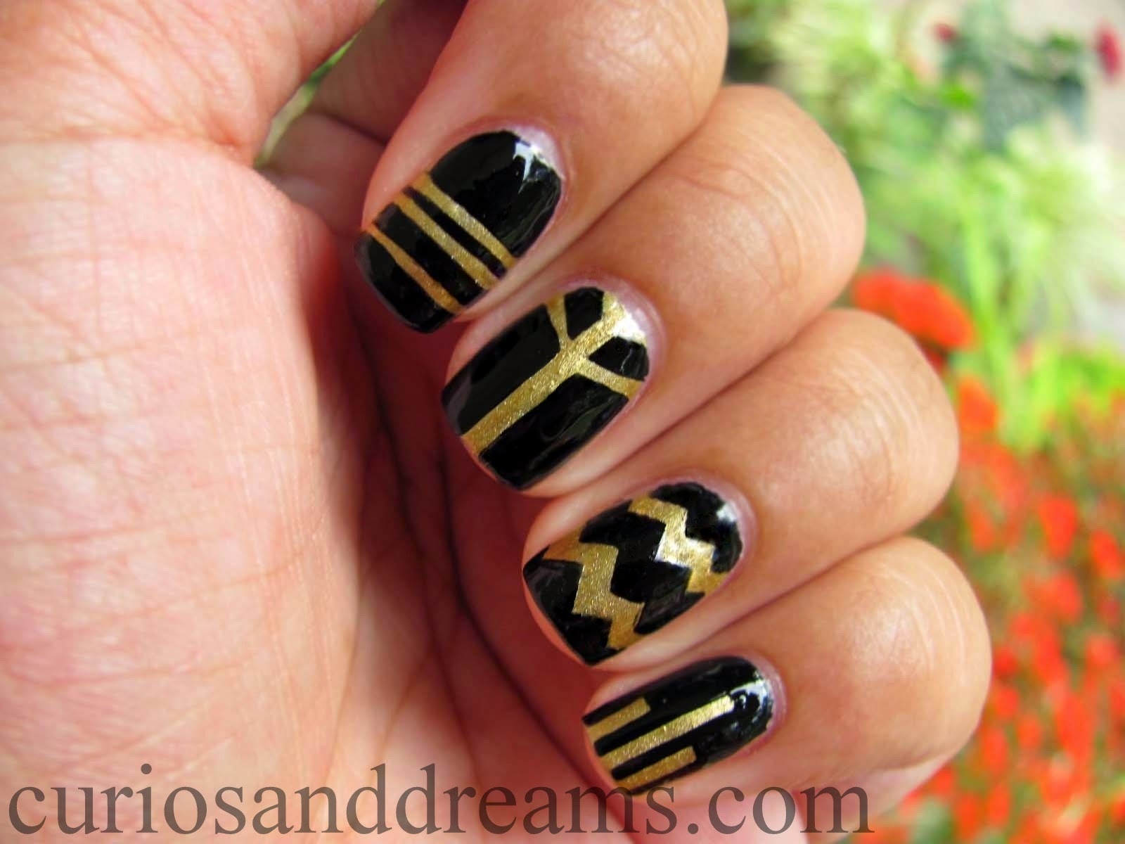 2. Elegant Matte Black and Gold Nail Design - wide 5