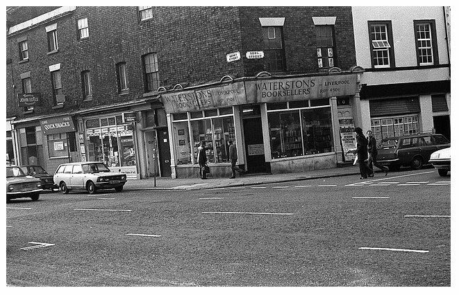 Given that the giant Waterstone's booksellers were only established in 1982, and this shop was in existence since at least 1970, it must be sheer coincidence that the names are so similar. The Blue Angel Nightclub is next door.