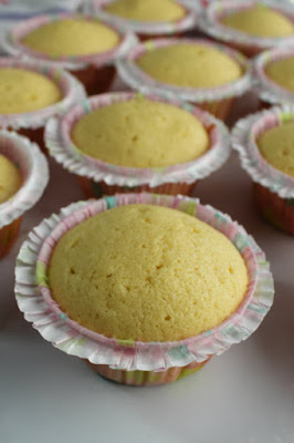 baked butter vanilla cupcakes in frilly liners