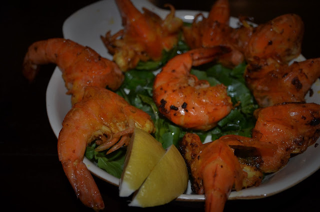 Quick starter salad of butterfly prawns on a bed of rocket leaves