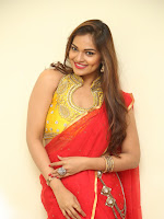 Aswini new sizzling pics in Red half saree-cover-photo