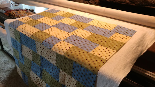Quilting charity quilts on my new longarm