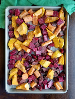 Roasted fall vegetables are made perfectly tender and lightly caramalized with a hint of Chinese five spice to give them that extra something. It's a delicious fall side dish. veggies spread over half sheet pan
