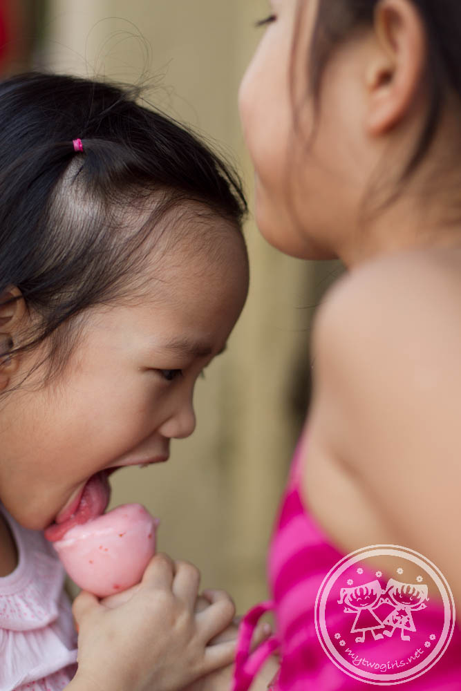 Girls Sharing an ice cream