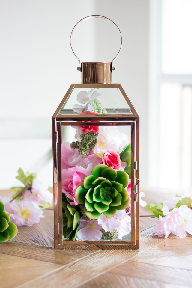 These faux floral lanterns would be perfect for a spring wedding or shower centerpiece!