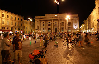 The Piazza del Popolo is a popular meeting place where friends gather in Pesaro