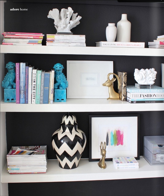 Give your bookcases/shelves a high end look by lining them with black wallpaper! It really helps accessories pop. via monicawantsit.com