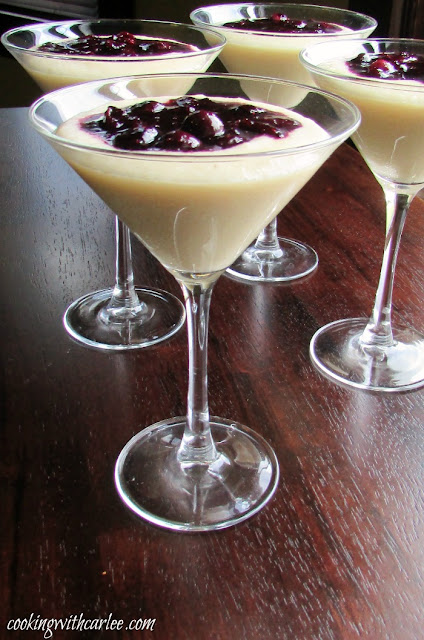 This simple dessert is perfect for al fresco dining. It is elegant enough for a dinner party and simple enough for just because. If you haven't tried cornmeal pudding yet, you really should! martini glasses filled with cornmeal budino (pudding) and topped with a blueberry marmellata sauce