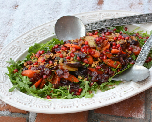 Celebration Salad (Maple-Roasted Carrots with Arugula, Dill, Cranberry Vinaigrette, Pomegranate and Glazed Pecans), an exultant platter of vegan texture, color, flavor and mood ♥ KitchenParade.com