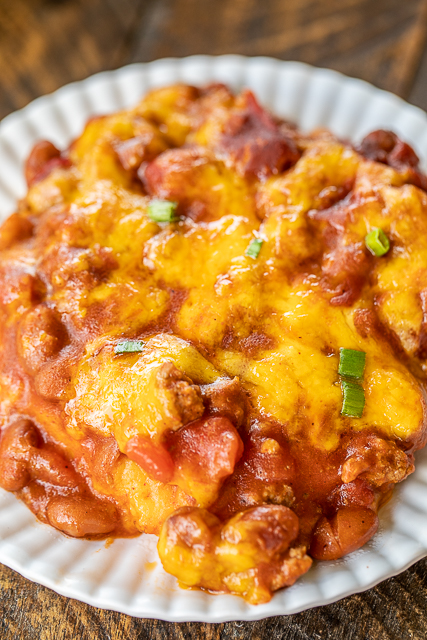 Chili & Cornbread Casserole - sweet cornbread topped with a quick homemade chili and cheese. Comfort food at its best!!! Top with your favorite chili toppings. We like sour cream, fried onions and jalapeños. Jiffy mix, creamed corn, eggs, milk, cheese, ground beef, chili seasoning, diced tomatoes, chili beans, tomato sauce. The whole family LOVED this easy weeknight casserole! It is definitely going into the rotation! #casserole #chili #cornbread #weeknightdinner Chili & Cornbread Casserole - sweet cornbread topped with a quick homemade chili and cheese. Comfort food at its best!!! Top with your favorite chili toppings. We like sour cream, fried onions and jalapeños. Jiffy mix, creamed corn, eggs, milk, cheese, ground beef, chili seasoning, diced tomatoes, chili beans, tomato sauce. The whole family LOVED this easy weeknight casserole! It is definitely going into the rotation! #casserole #chili #cornbread #weeknightdinner