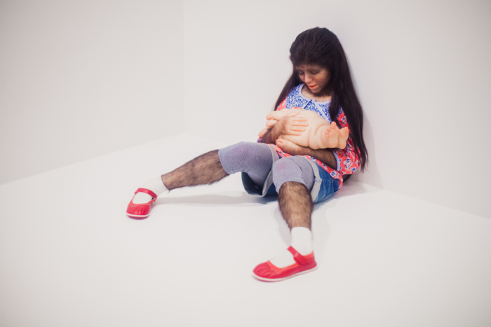 Patricia Piccinini - The Comforter hairy leg girl sculpture