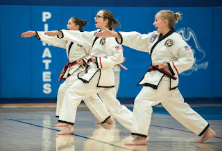 Teenagers practicing martial arts during lessons