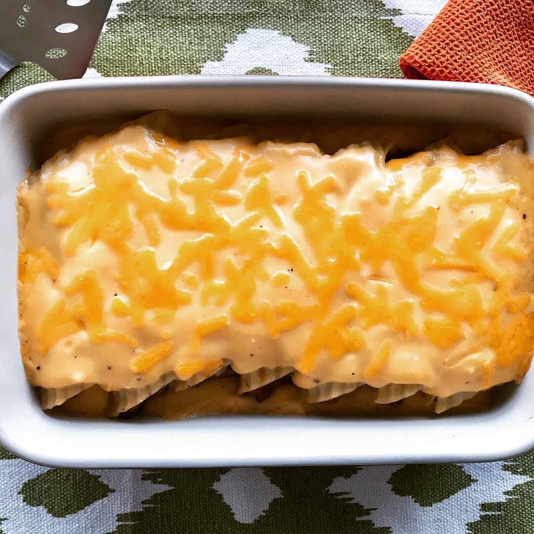 Philly Cheesesteak Manicotti with Creamy Cheddar Cheese Sauce