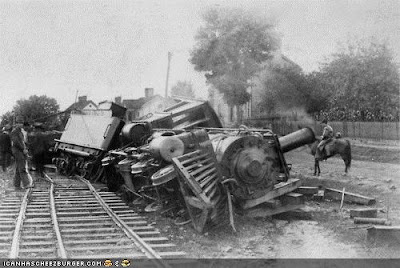 black and white photo of derailed train