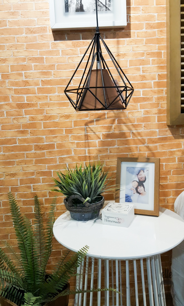 brick wall paper, hanging light, side table