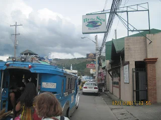 Boarding and riding in a jeepney in Baretto Township - an AmStar Realty Group photo