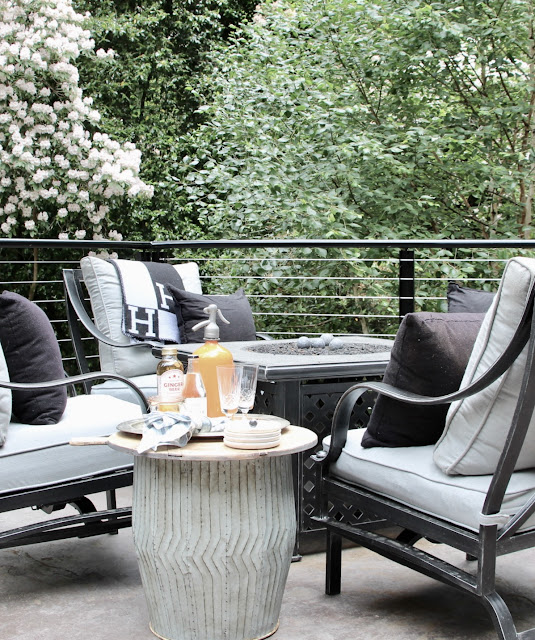 Firepit. Cozy cottage style with black and white in a lake house byy Sweet Savannah. Modern farmhouse meets coastal cottage style! #cottagestyle #modernfarmhouse #interiordesign #rusticdecor #coastalcottage