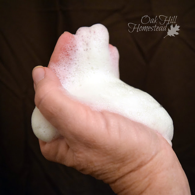 A handful of suds from a shampoo bar