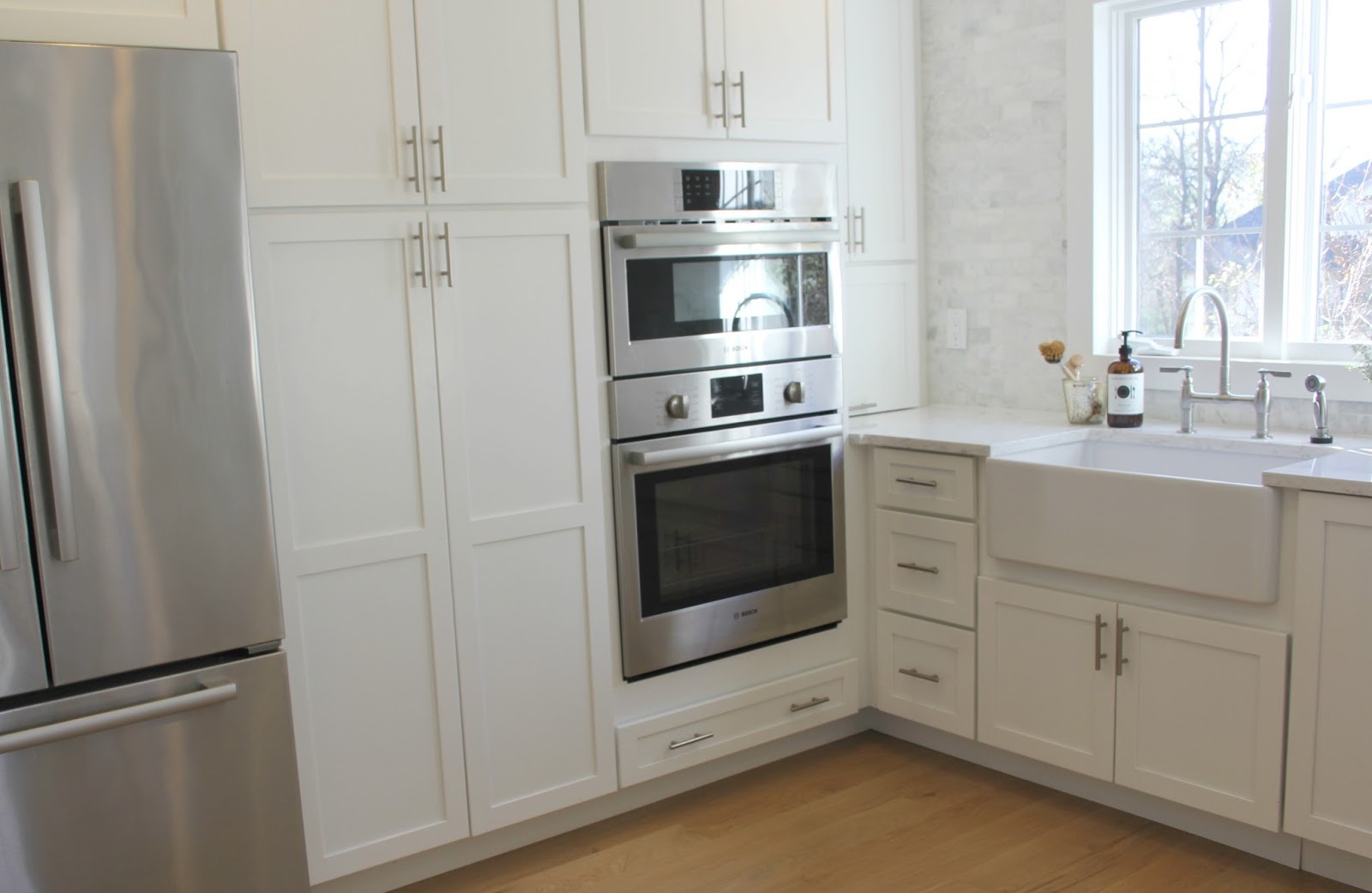 Minimal modern farmhouse white Shaker kitchen by Hello Lovely Studio