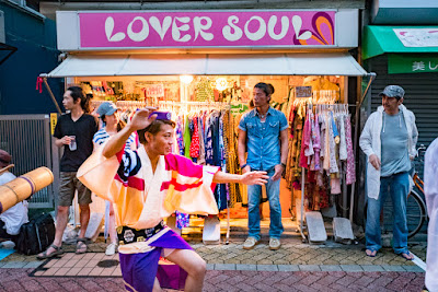 Dancer in front of one of Koenji's many clothing shops, 60th Koenji Awa-Odori Festival, Tokyo, Japan. Dancer in front of "Lover Soul" clothing store, one of many in Koenji, at the 60th Koenji Awa-Odori Festival, Tokyo.