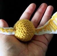http://www.ravelry.com/patterns/library/almost-golden-snitch