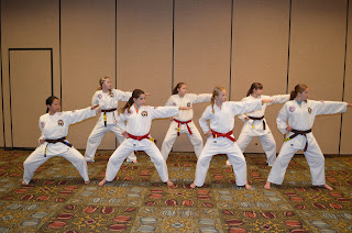 Karate girls doing a knife hand strike