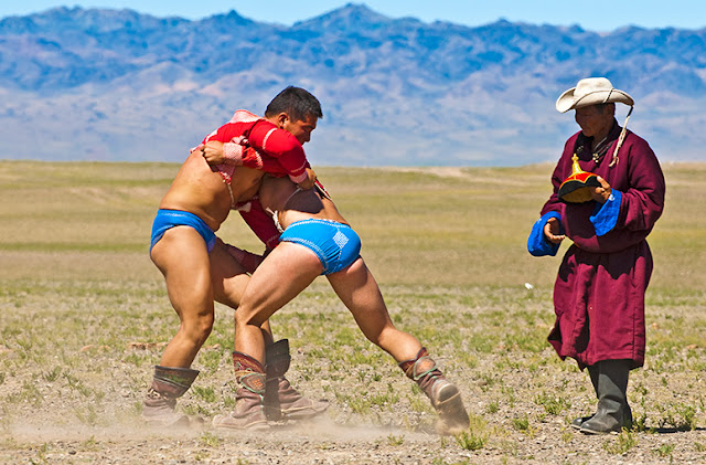 The Gobi Gurvan Saikhan mountains form a dramatic backdrop to this local Naadam wrestling event in the southern Gobi. Bayandalai, Omnogobi Aimag Local Naadam wrestling event in the southern Gobi. Bayandalai, Omnogobi Aimag
