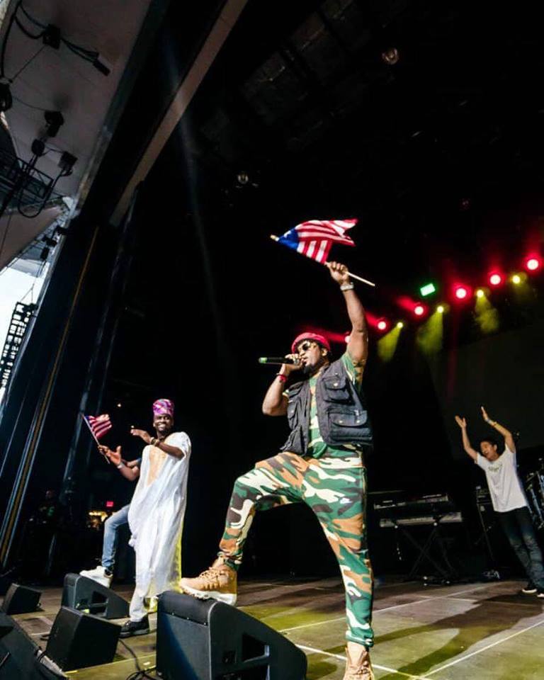 deng flies high the liberian flag at one africa music fest 2018