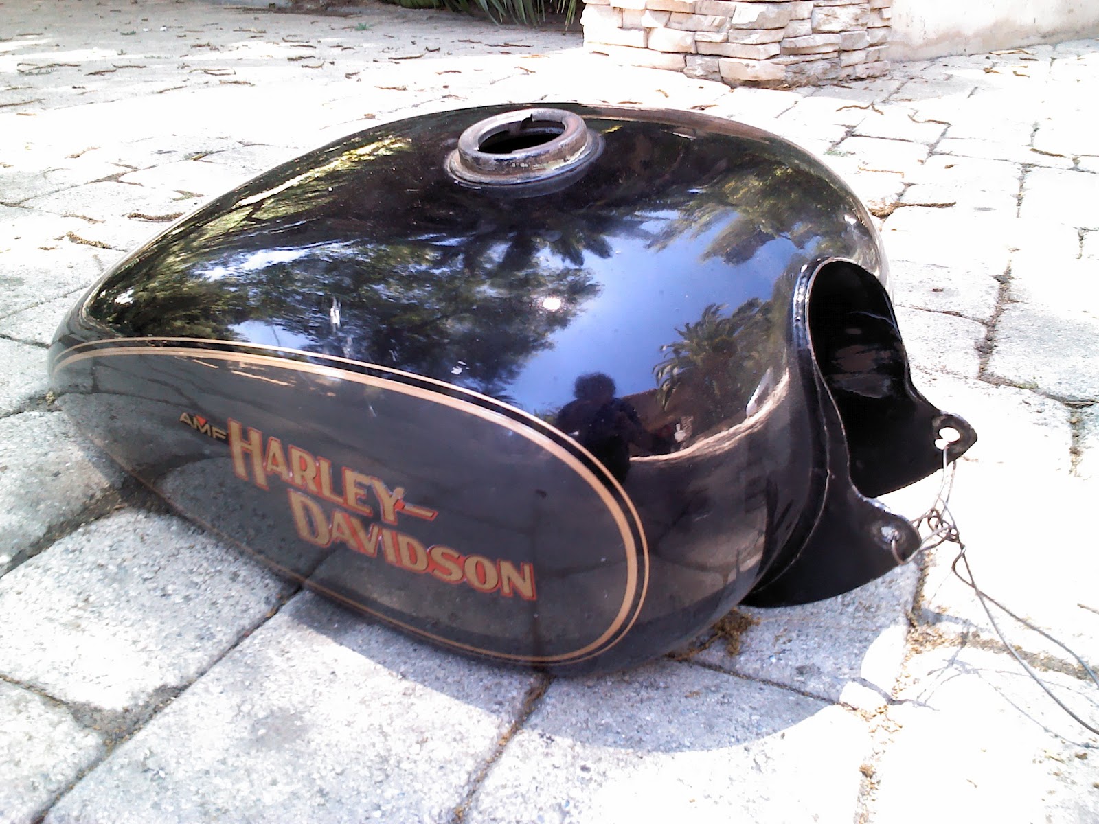 It's just junk parts cooperative.. AMF Harley gas tank in grey/black