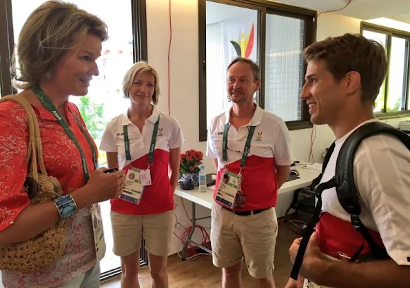 Queen Mathilde visited the Olympic Village, Queen wore Jeans trousers, printed blouse, wore Natan flat shoes, wore Cartier sungless Sunglasses, gold diamond earrings