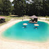 Homeless Man Becomes Millionaire by Building Beaches in People’s Backyards