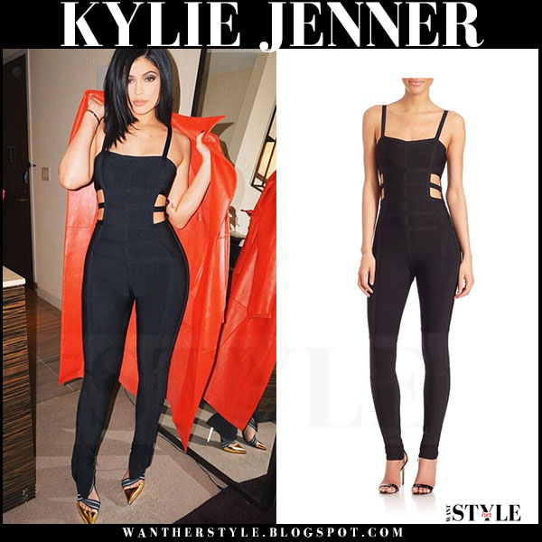 Kylie Jenner in black cutout jumpsuit and red coat in New York on