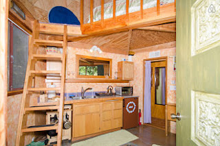 Downstairs at the Mushroom Dome Cabin is a kitchen, sitting area and bathroom.
