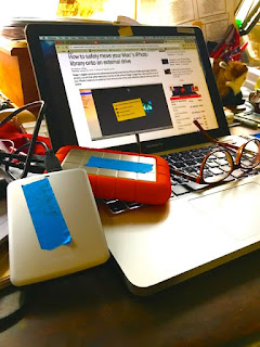 Photo of MacBook, external drives