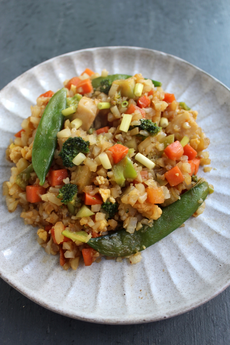 Cauliflower Fried Rice with Chicken uses riced cauliflower instead of rice for extra fiber and vitamins, lots of veggies and is ready in just 15 minutes! www.nutritionistreviews.com