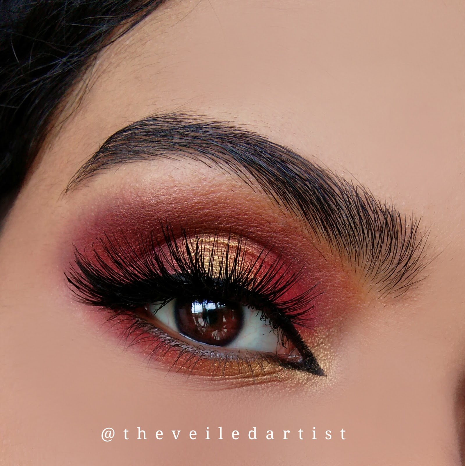red and gold halo smokey eyes with dramatic arabic winged liner