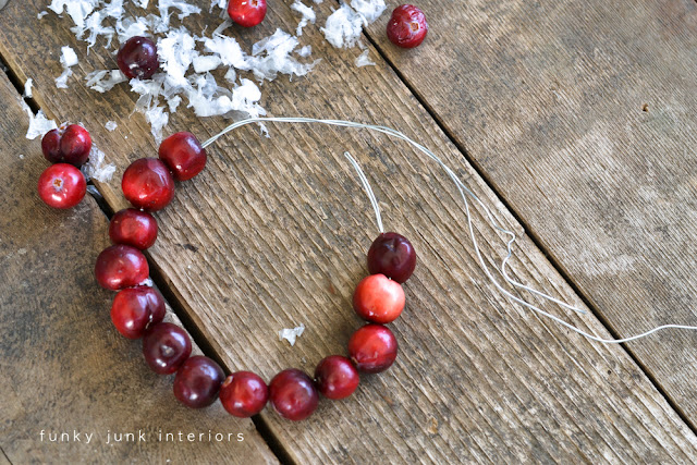 cranberry garland / Christmas old window picture in the kitchen, viahttps://www.funkyjunkinteriors.net/