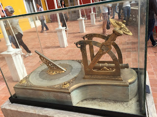 Saw this contraption on an outside terrace - it's a sundial cannon!