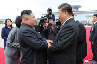 Kim Jong Un dan Xi Jinping 
