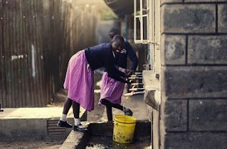 School girls collecting water