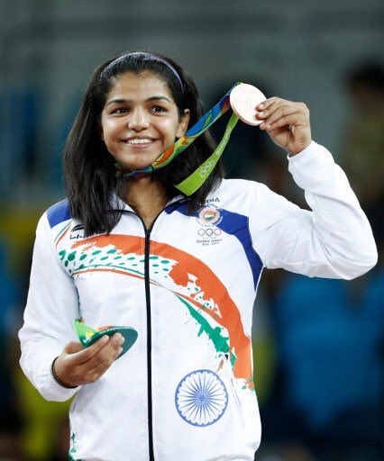 Sakshi Malik First Indian Woman Wrestler Winner Bronze Medal in Olympics Rio 2016 Celebration Indian Flag Medal Rohtak Girl Haryana