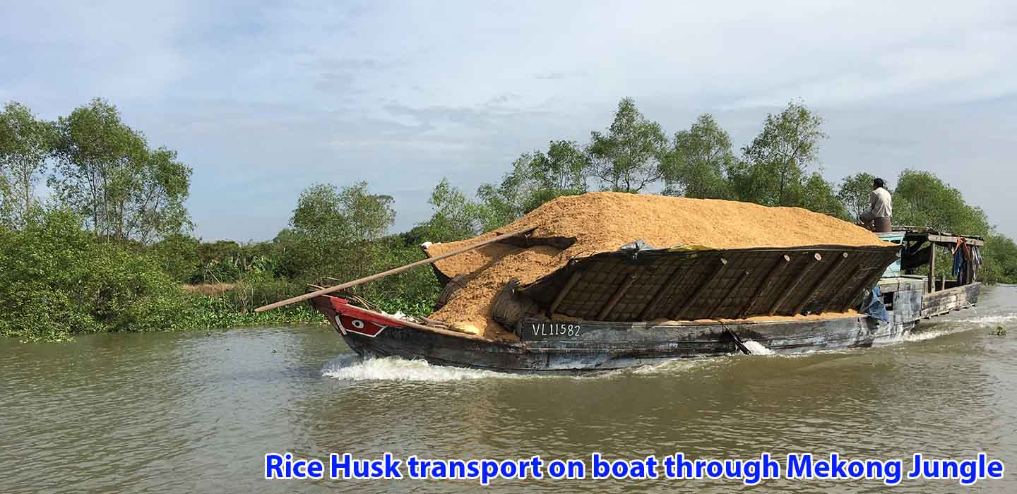real-mekong-delta-tour-Rice-Husk-transport-on-boat-1
